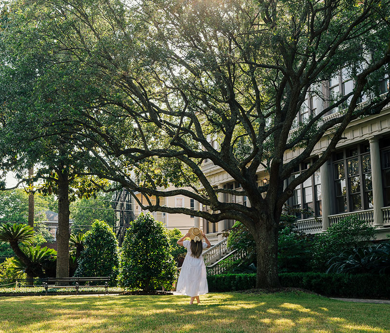 Woman enjoying the grand lawn at Wenworth Mansion