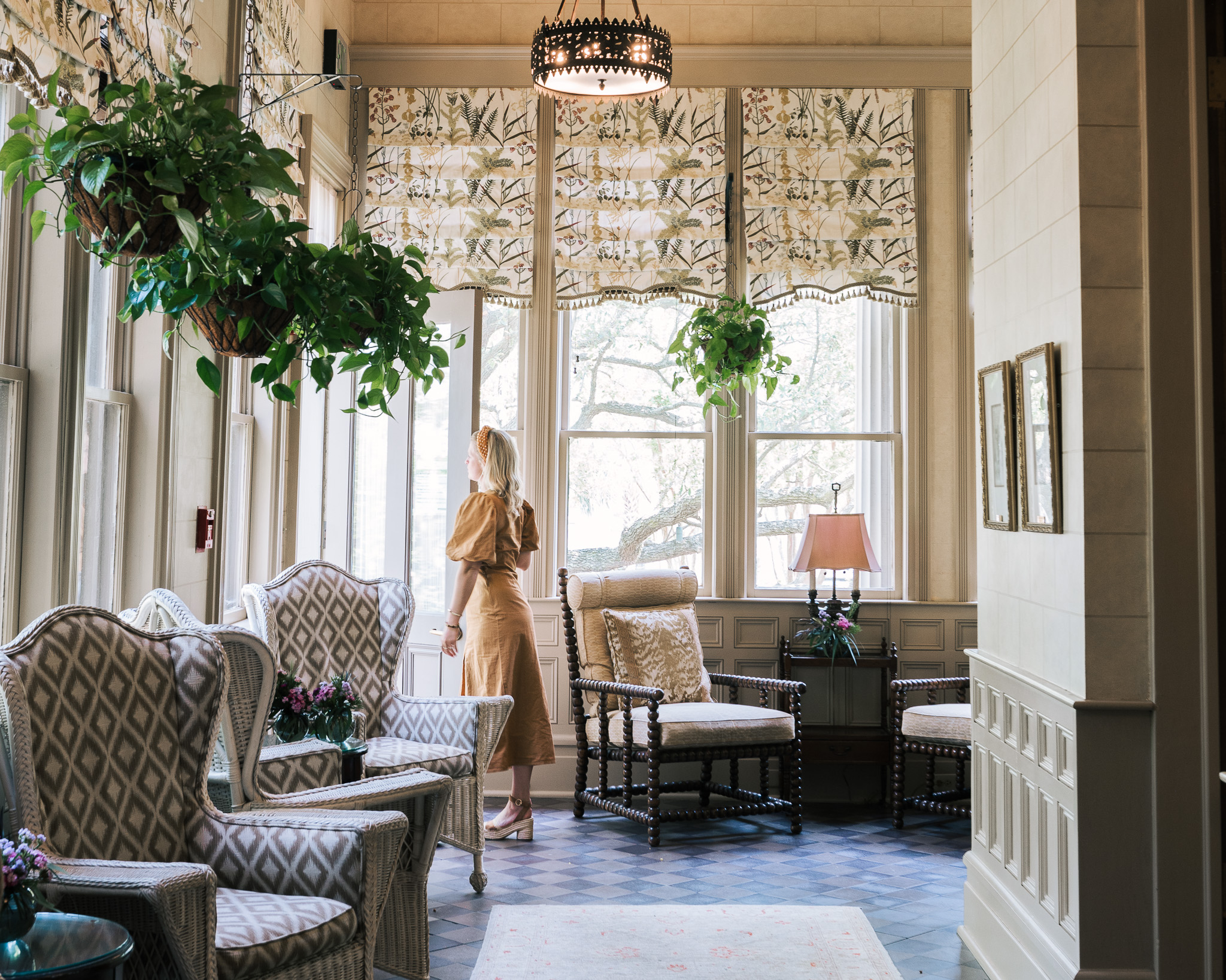 Woman enjoying the Sunporch at Wentworth Mansion