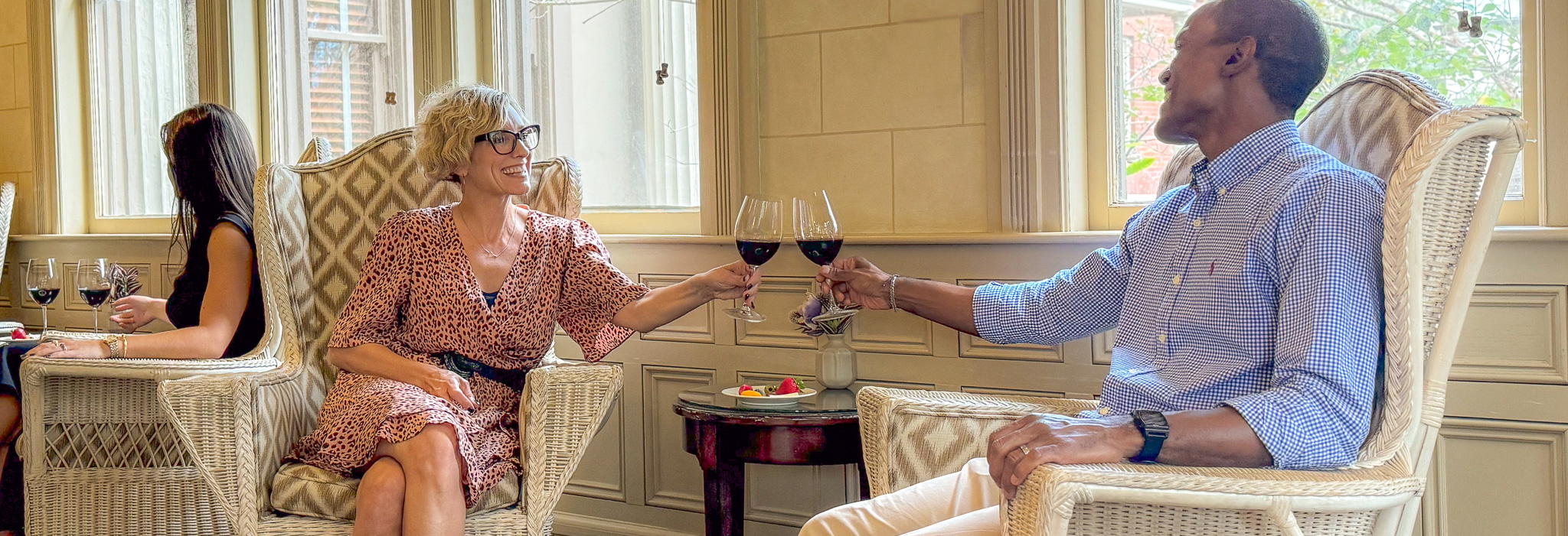 Guests enjoying wine and cheese on the sunporch